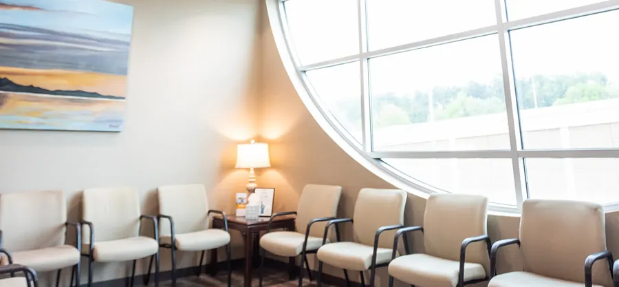 The waiting room, with its curved wall of windows.